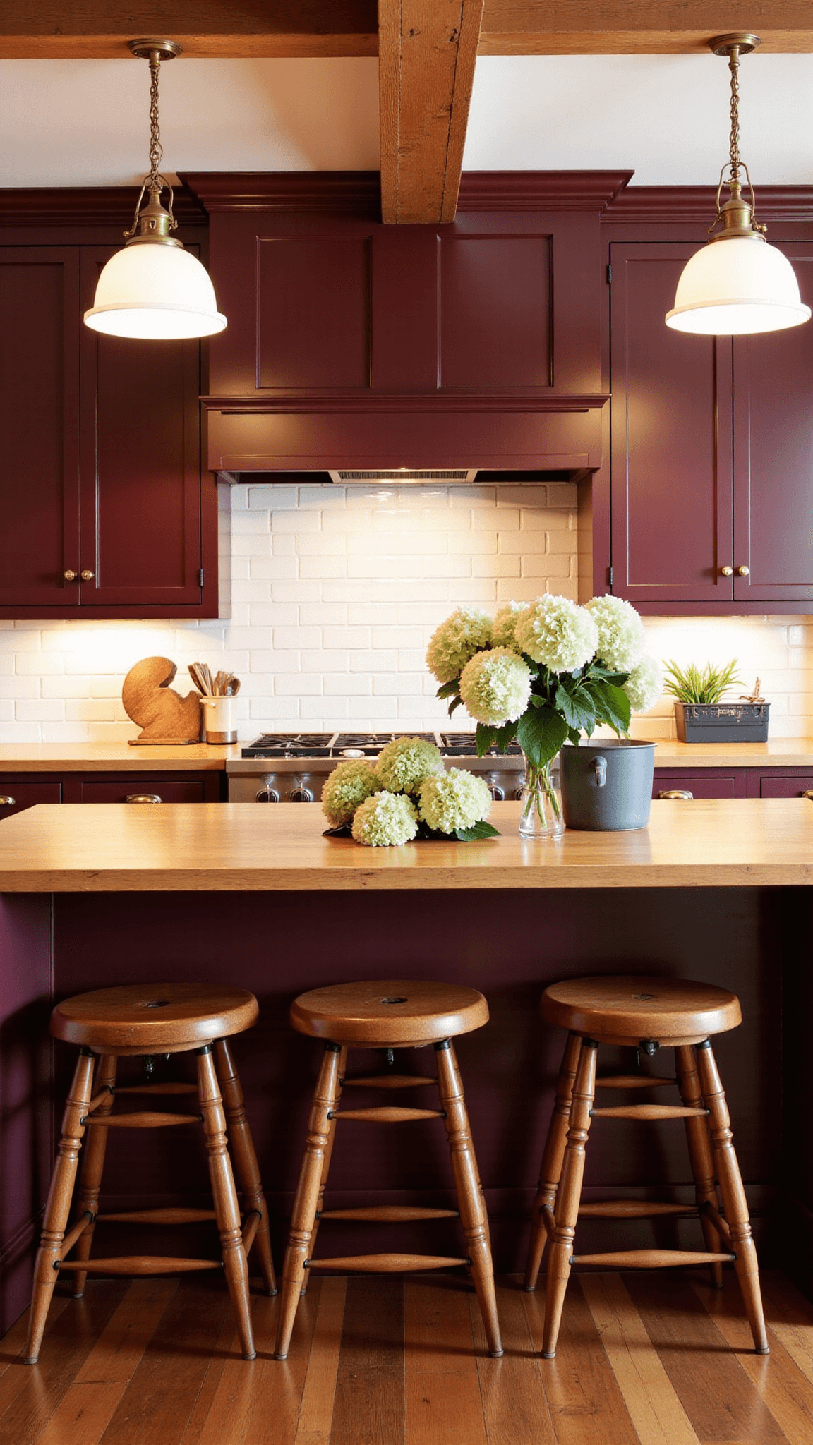 Spacious country kitchen with matte burgundy shaker cabinets, rustic butcher block countertops, white subway tile backsplash, exposed wooden beams and vintage pendant lights casting warm glow in golden hour light, featuring center island with vintage stools and fresh hydrangeas.